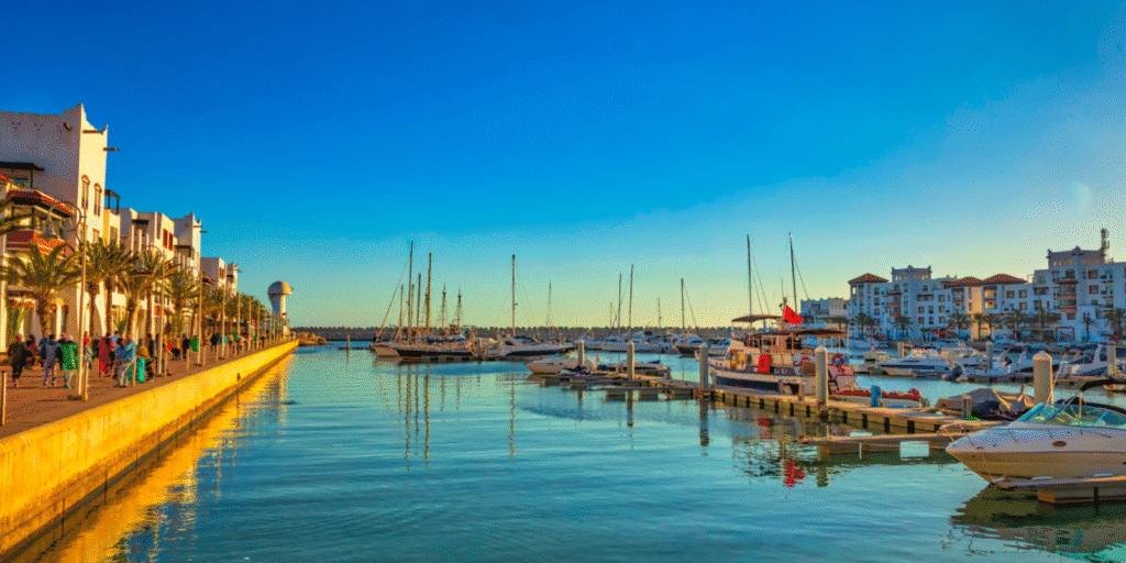 Private Intercity Transfers in Morocco - Travel in Absolute Comfort with Kechtravel Luxury Mercedes car with professional Moroccan driver on the road from Marrakech to Agadir under sunset light