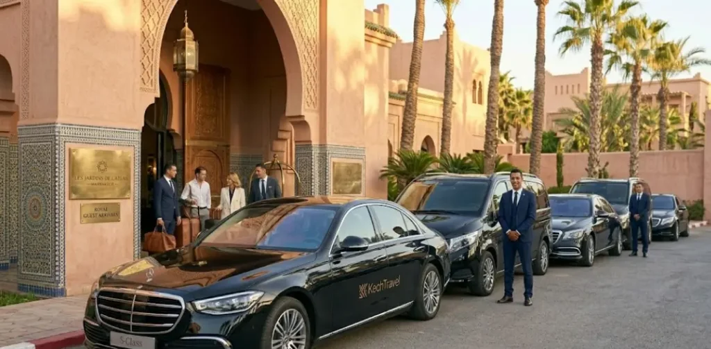 A neat lineup of pristine luxury sedans and executive vans parked outside a five-star luxury hotel entrance in Morocco.